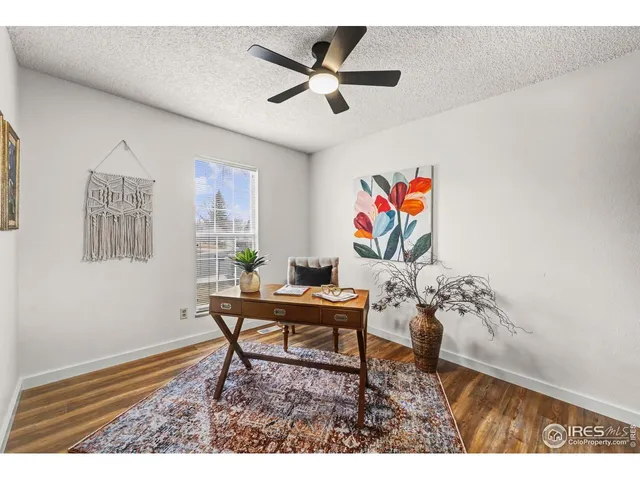 a workspace with furniture and window