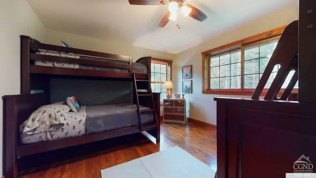 a bedroom with furniture and a window