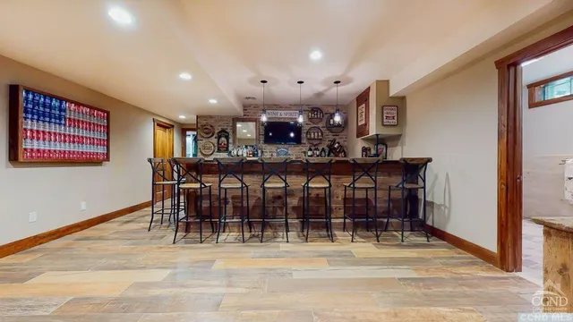 a view of a a dining room with furniture window and wooden floor