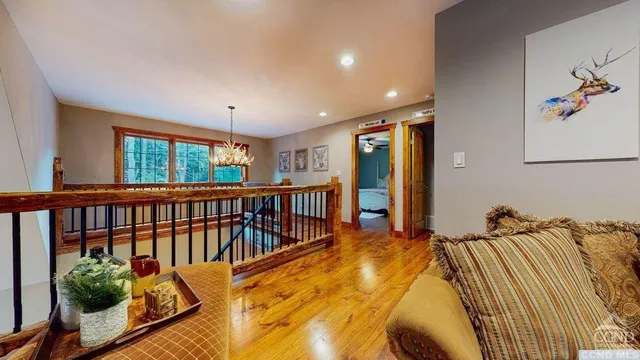 a bed sitting in a balcony next to a window
