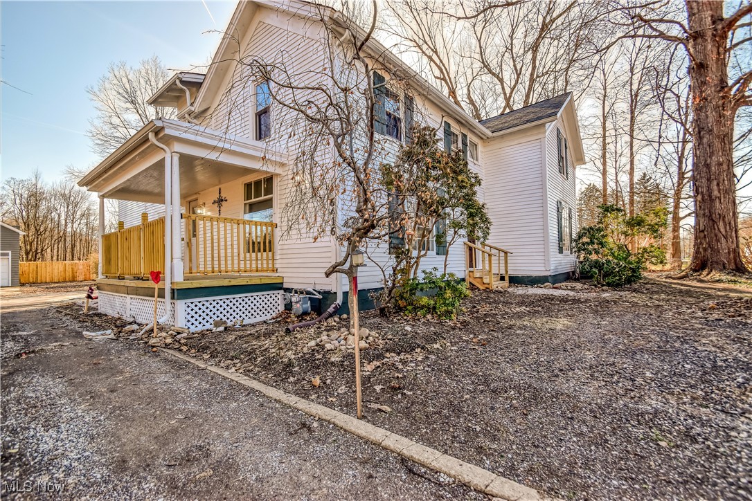 6416 Chapel Road Madison, OH 44057 - Photo 2 of 35 View of home's exterior with a porch and an outbuilding