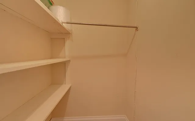 a view of small space with racks on the wall