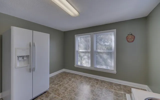 a view of an empty room with windows