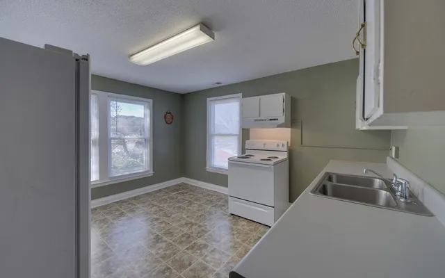 a room that has a bed and a chair in it