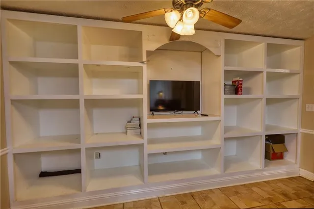 a kitchen with stainless steel appliances granite countertop a sink and cabinets