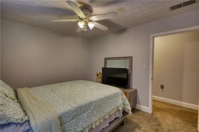 a view of a livingroom with furniture and a kitchen