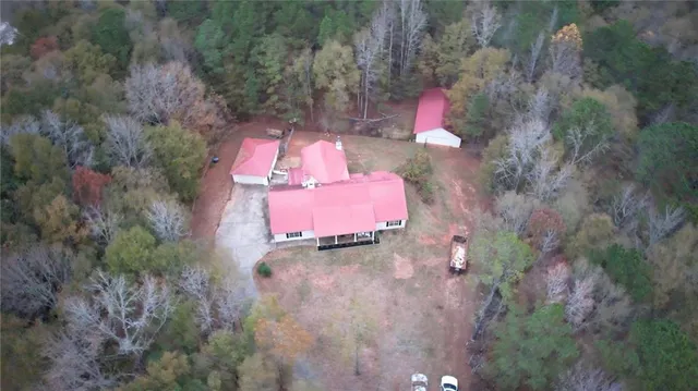 an aerial view of a house with outdoor space