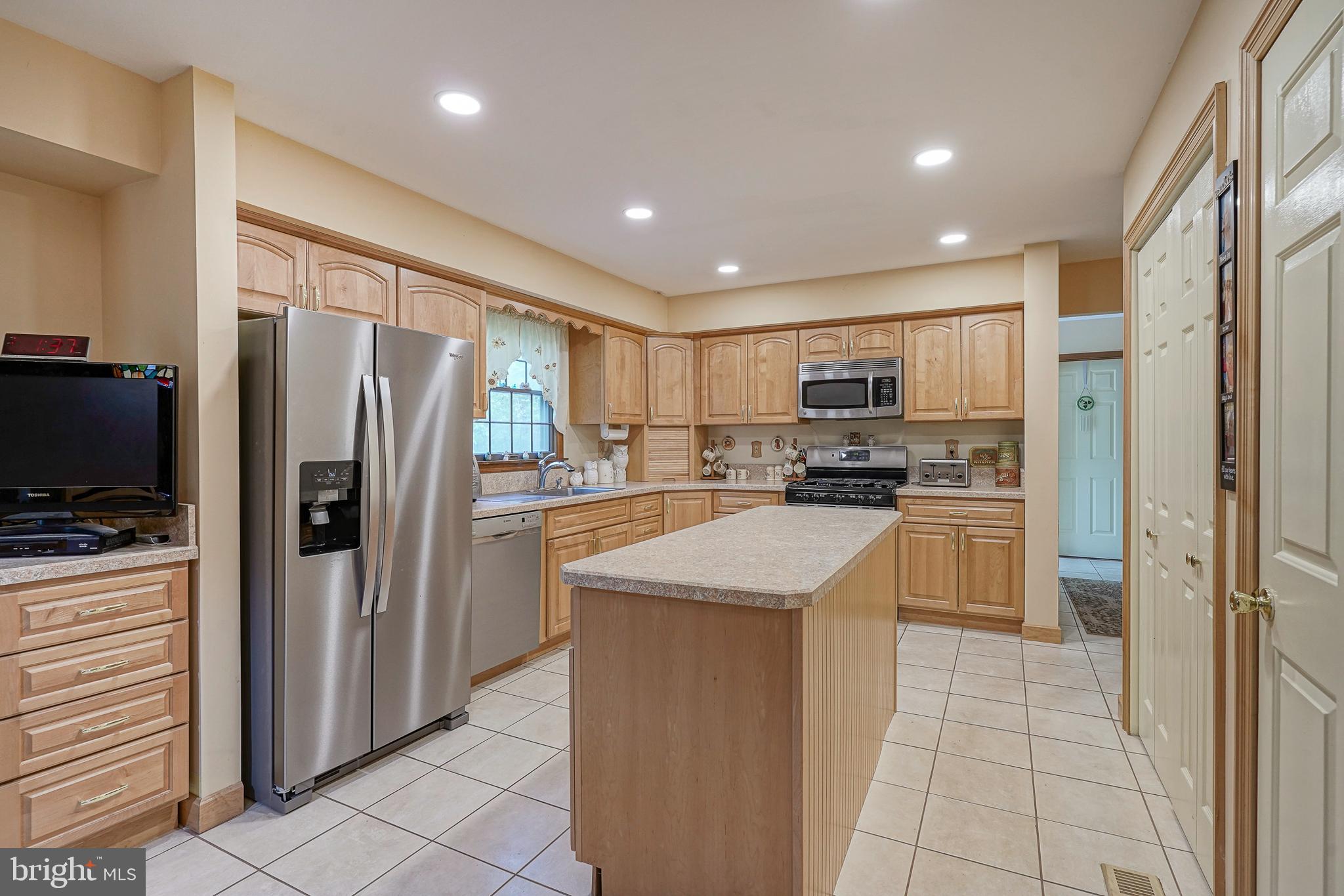 5 Meadowbrook Drive Shamong, NJ 08088 - Photo 11 of 39 a kitchen with stainless steel appliances granite countertop a refrigerator and a stove top oven
