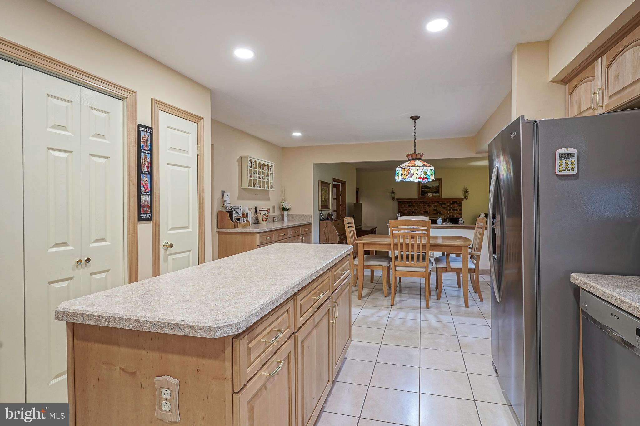 5 Meadowbrook Drive Shamong, NJ 08088 - Photo 12 of 39 a dining hall with stainless steel appliances granite countertop furniture a fireplace a rug kitchen view and a living room
