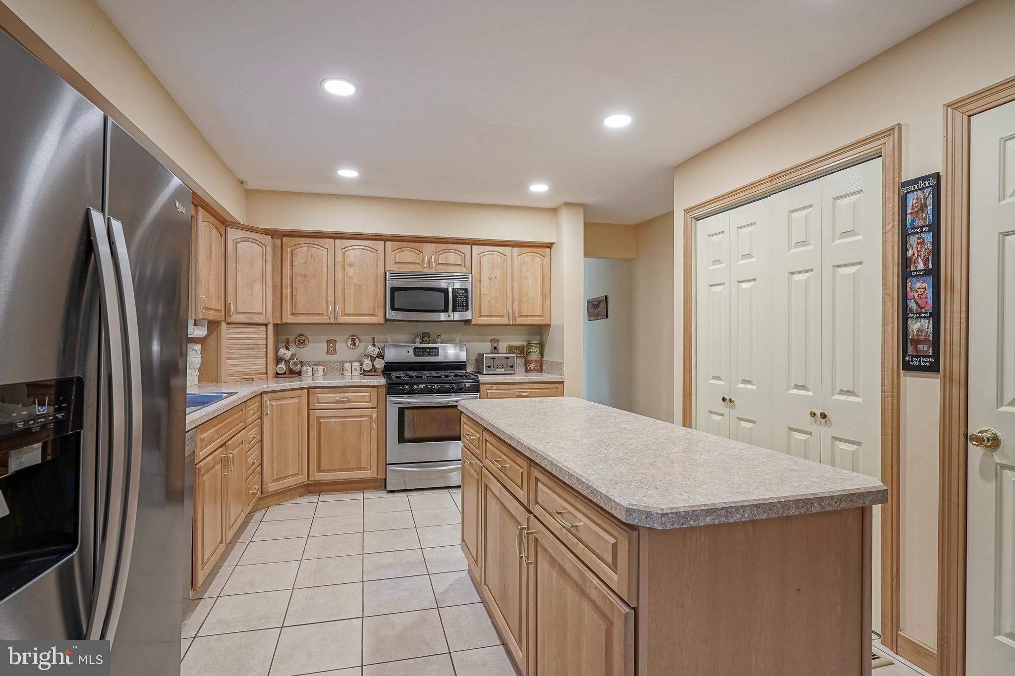 5 Meadowbrook Drive Shamong, NJ 08088 - Photo 14 of 39 a kitchen with a sink a counter top space stainless steel appliances and cabinets