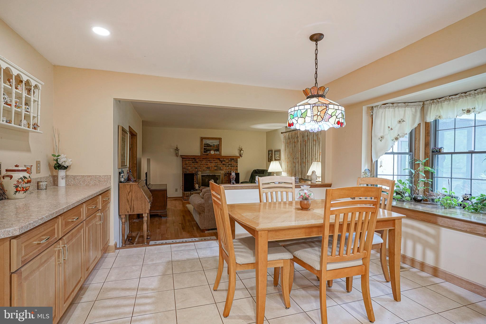 5 Meadowbrook Drive Shamong, NJ 08088 - Photo 16 of 39 a dining room filled chandelier and kitchen view