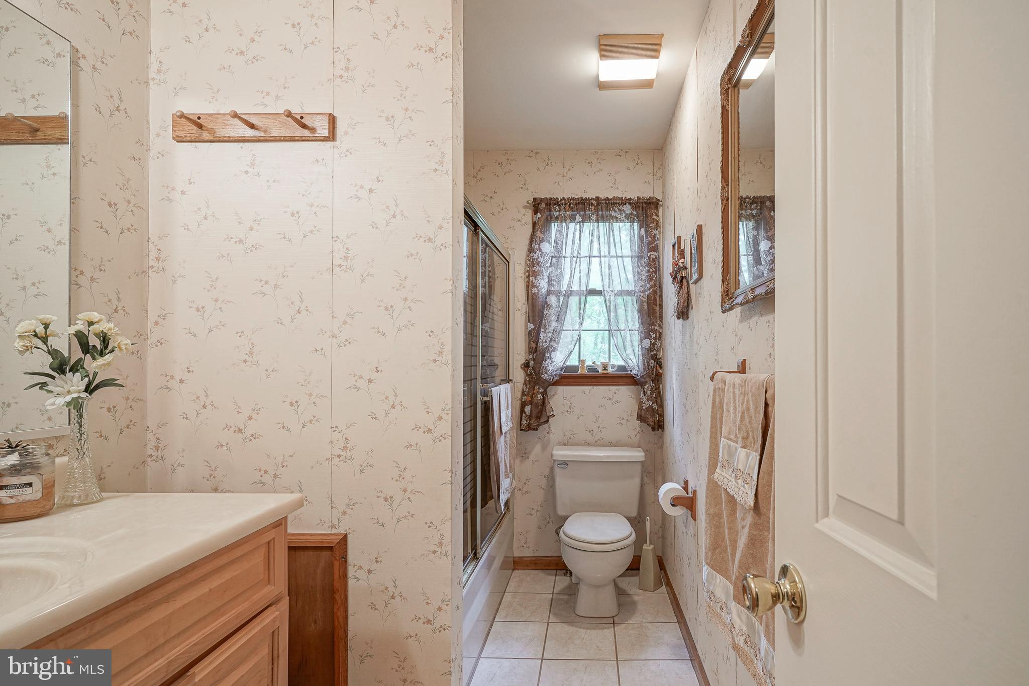 5 Meadowbrook Drive Shamong, NJ 08088 - Photo 24 of 39 a bathroom with a sink a toilet and shower