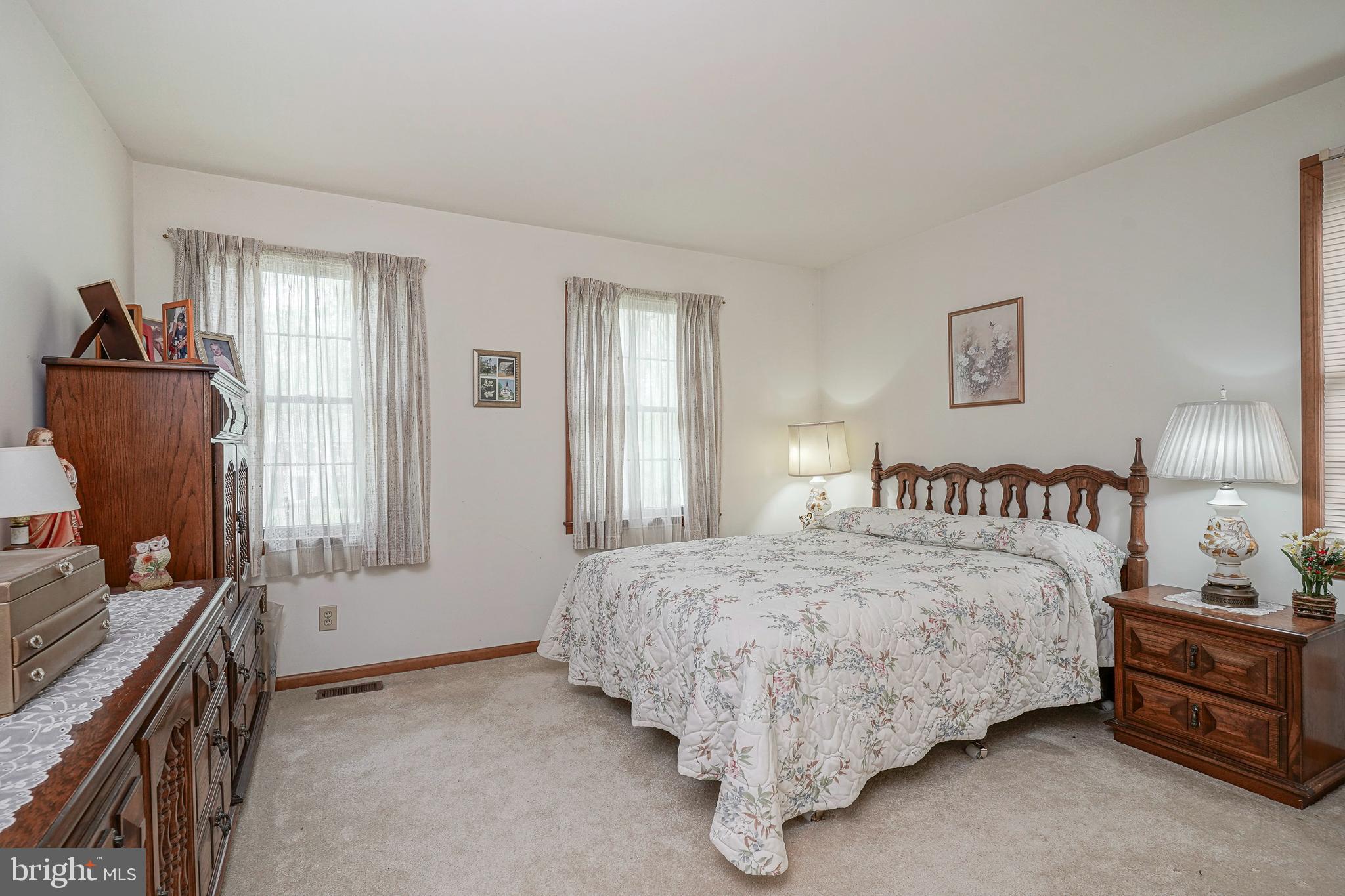 5 Meadowbrook Drive Shamong, NJ 08088 - Photo 27 of 39 a bedroom with a bed and wooden floor