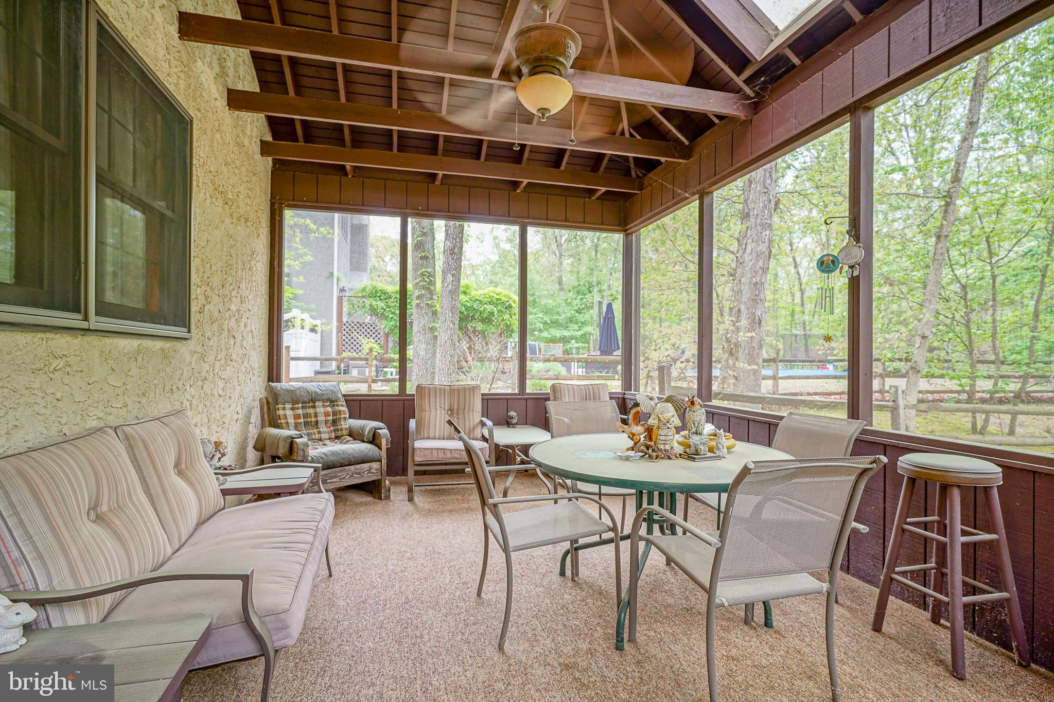 5 Meadowbrook Drive Shamong, NJ 08088 - Photo 34 of 39 a living room with furniture and a floor to ceiling window