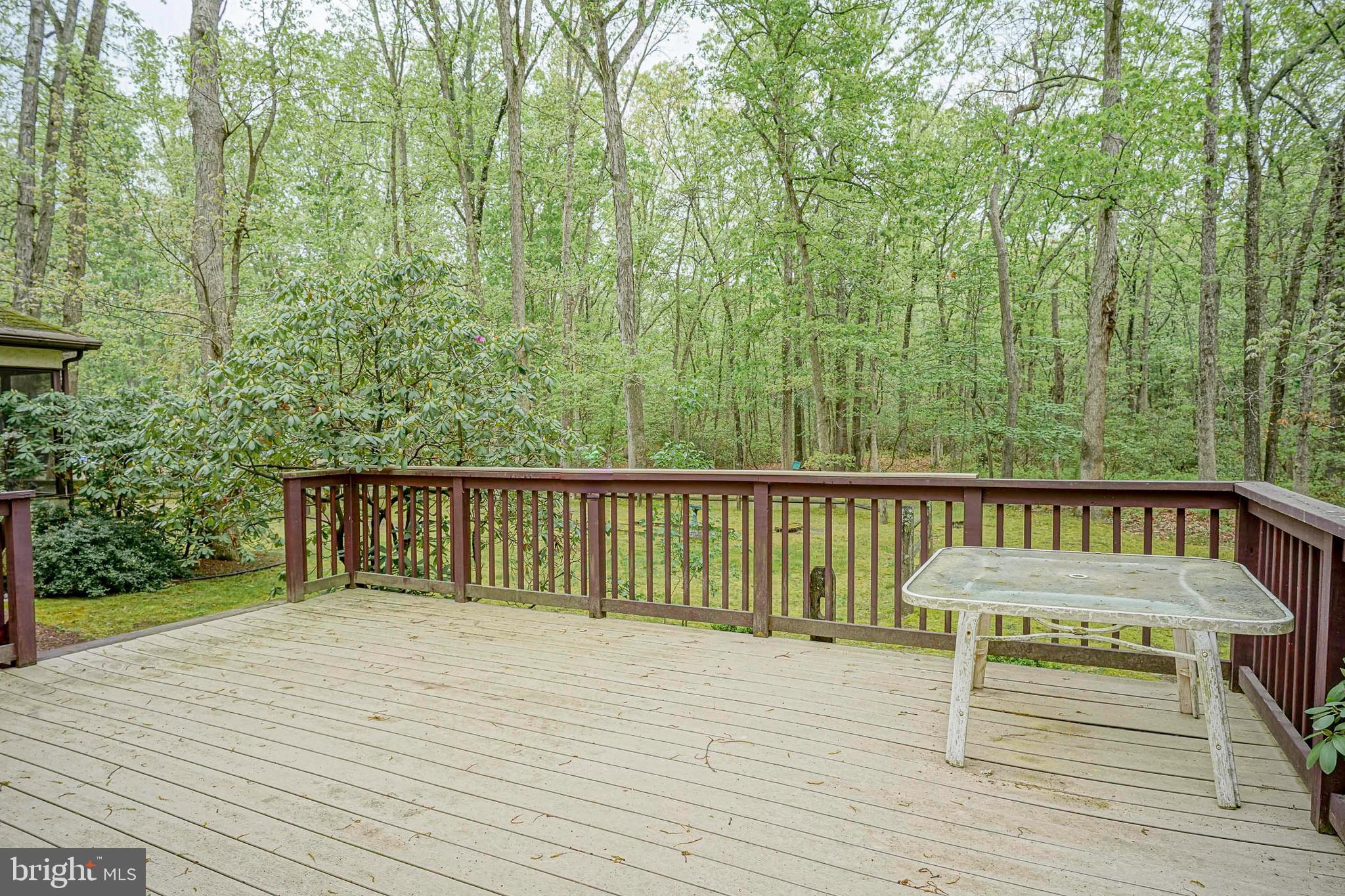 5 Meadowbrook Drive Shamong, NJ 08088 - Photo 35 of 39 a balcony with wooden floor and bench