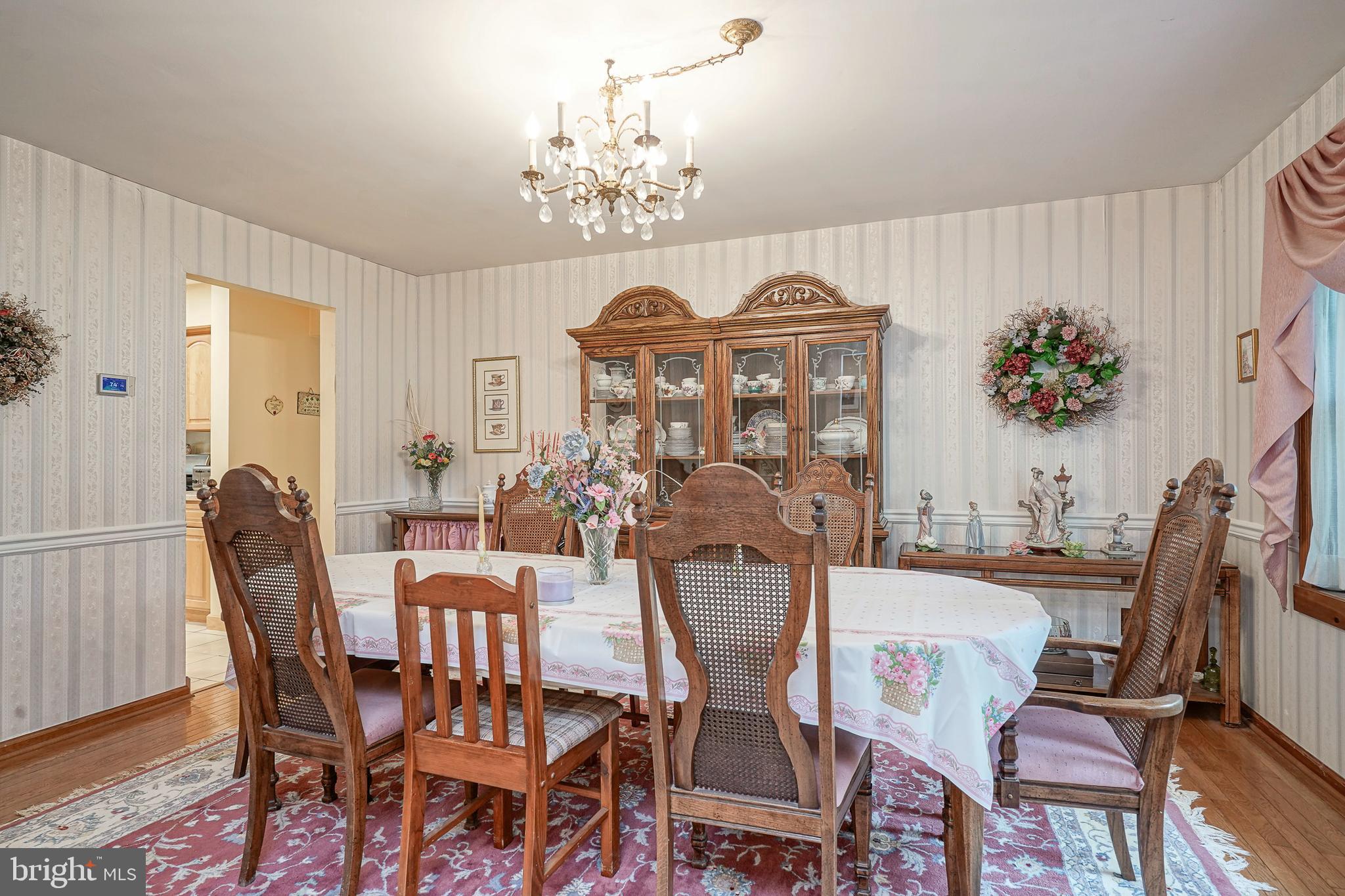 5 Meadowbrook Drive Shamong, NJ 08088 - Photo 5 of 39 a view of a dining room with furniture a chandelier and wooden floor