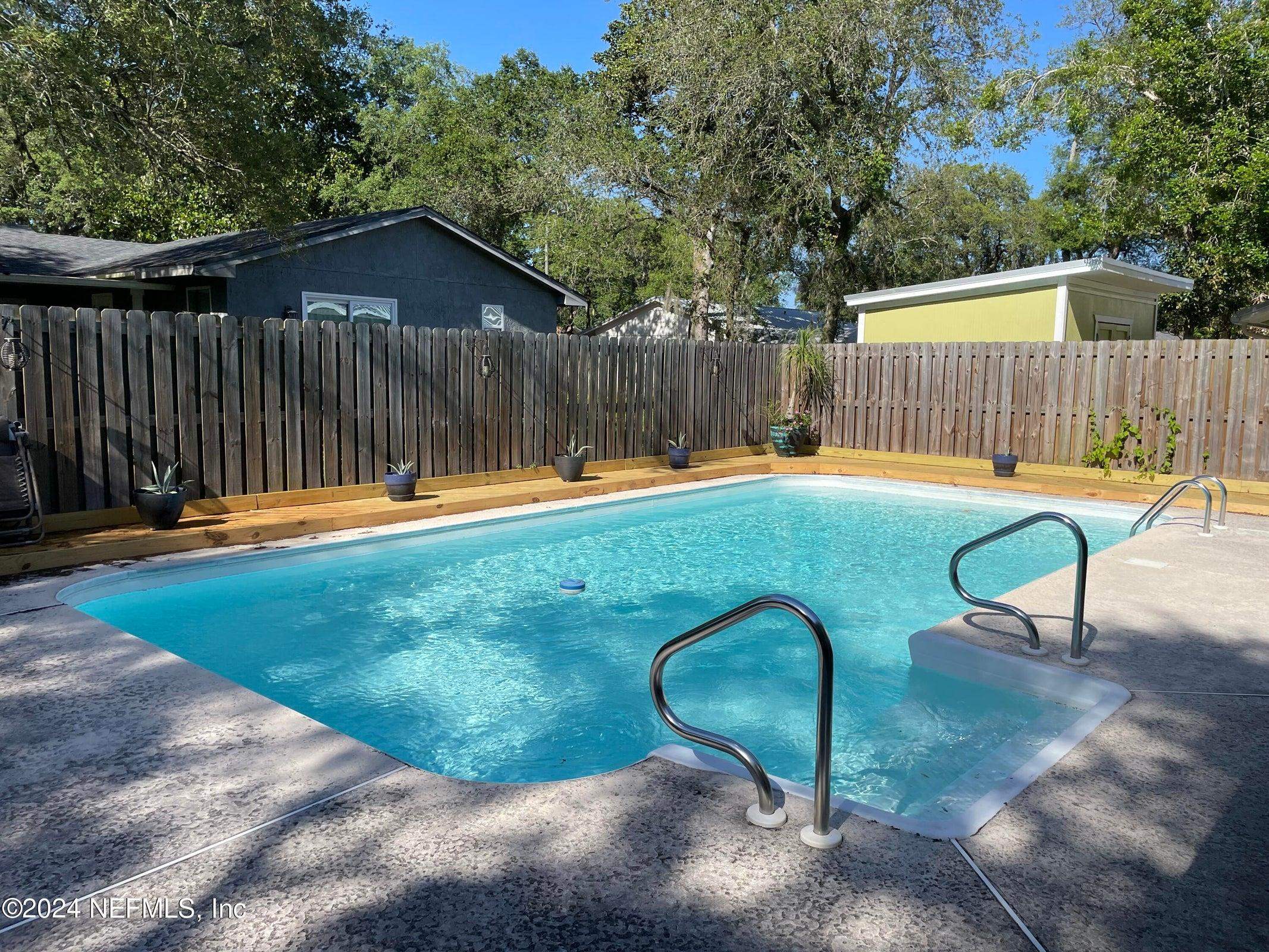 425 Gerona Road St. Augustine, FL 32086 - Photo 1 of 26 a view of a backyard with a slide