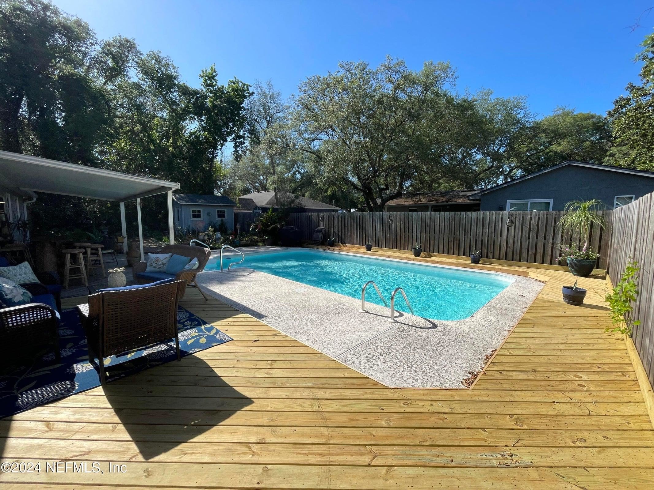 425 Gerona Road St. Augustine, FL 32086 - Photo 23 of 26 a view of a backyard with swimming pool