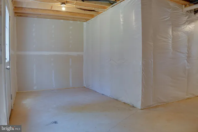 a kitchen with kitchen island a counter top space stainless steel appliances and a window