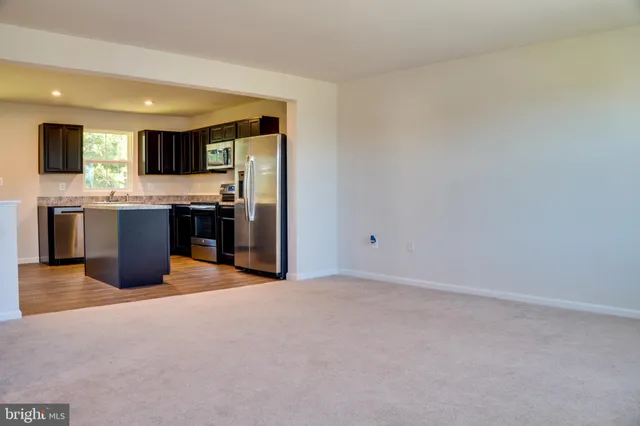 a bathroom with a sink a mirror and a toilet
