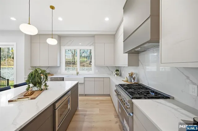 a kitchen with a sink stove and cabinets