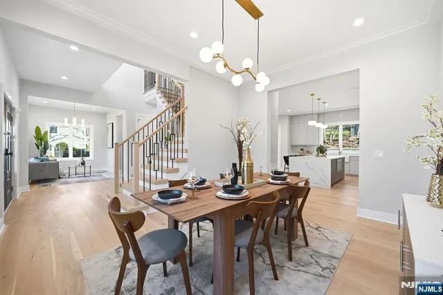 a view of a dining room with furniture and a chandelier