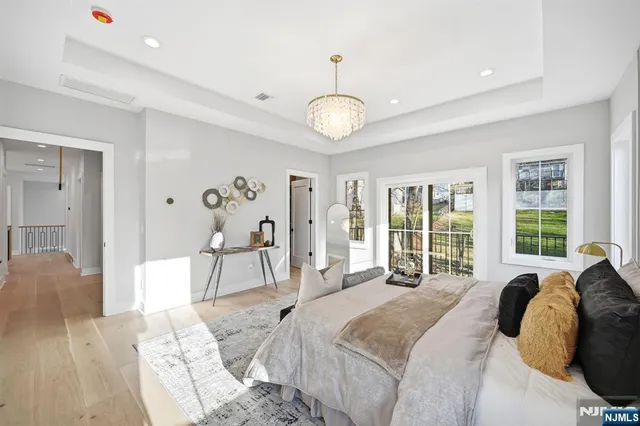 a bedroom with a bed and ceiling fan