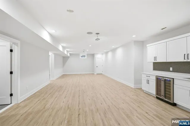 a view of a kitchen with a stove top oven