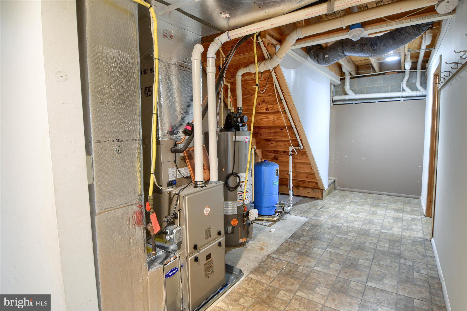 401 Dalton Road Oxford, PA 19363 - Photo 24 of 37 a view of walk in closet with clothes and shoes