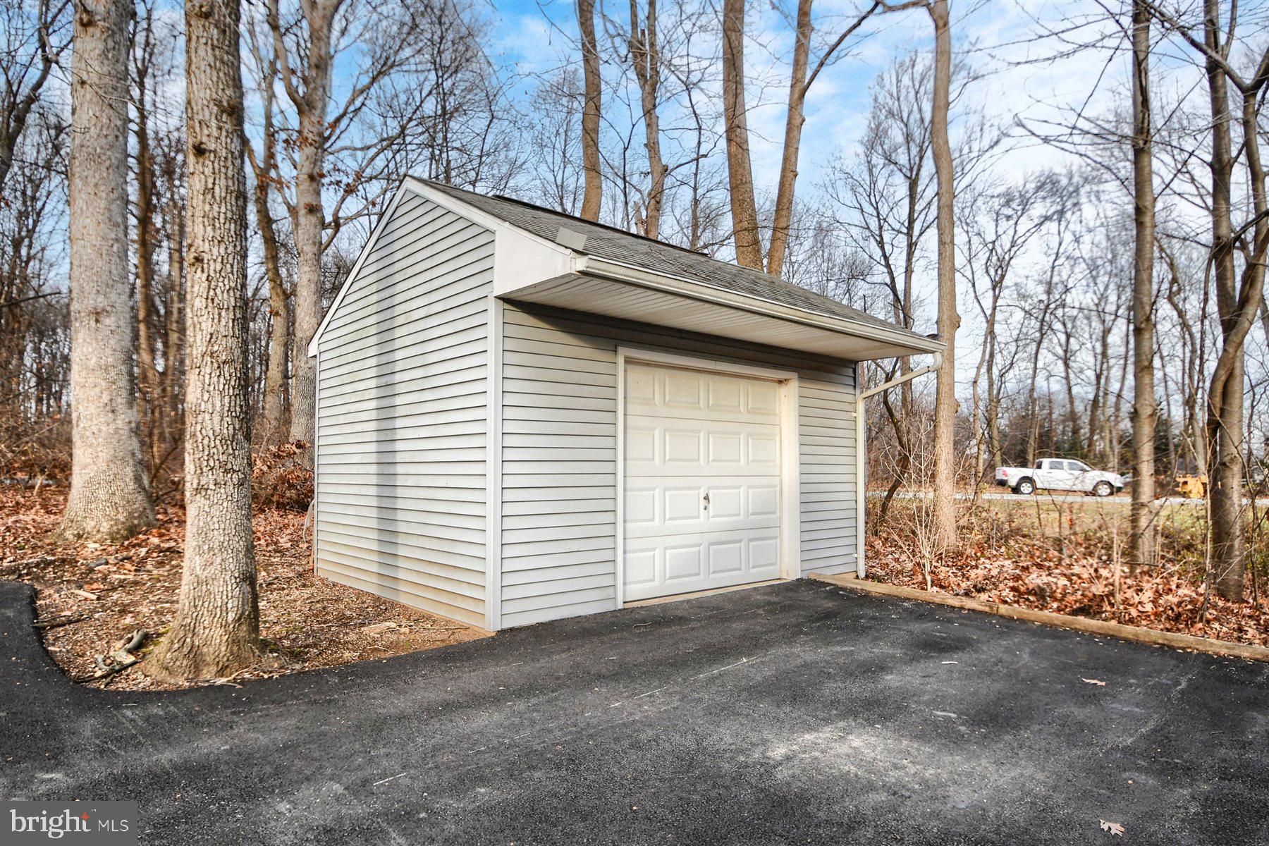 401 Dalton Road Oxford, PA 19363 - Photo 4 of 37 a view of a house with a yard and garage