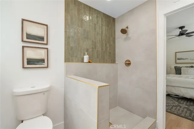 a bathroom with a toilet sink and shower