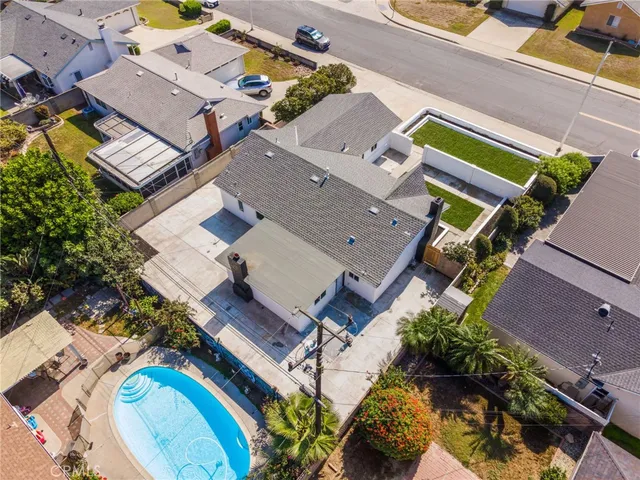 an aerial view of a house with a swimming pool