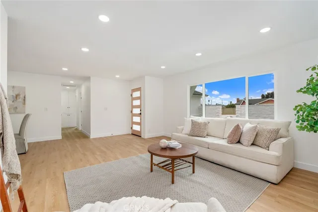 a living room with furniture and a rug