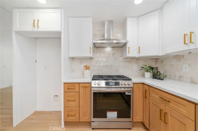 a kitchen with cabinets and appliances