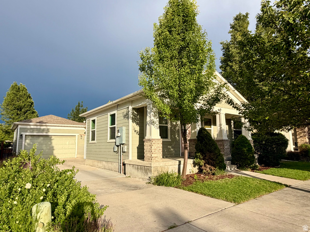 11751 Lake Run Road South Jordan, UT 84009 - Photo 38 of 38 Single-story residence featuring light green siding and a covered front porch with brick and stone accents