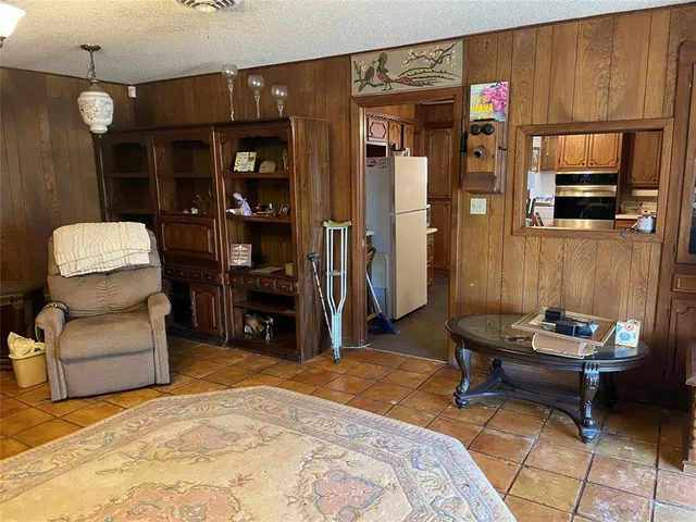 a bedroom with furniture and a closet