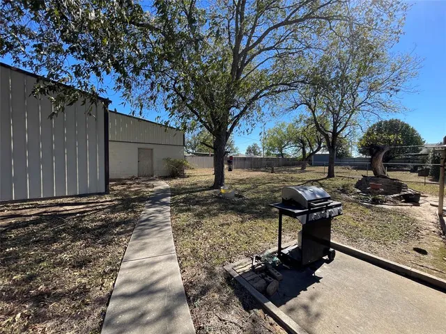 a view of a backyard with sitting area