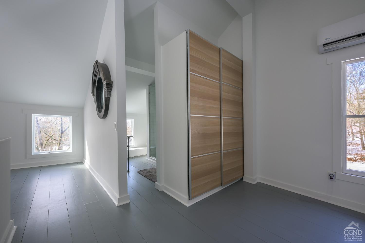 203 Stone Jug Road Craryville, NY 12521 - Photo 21 of 29 a view of an empty room with a window and wooden floor