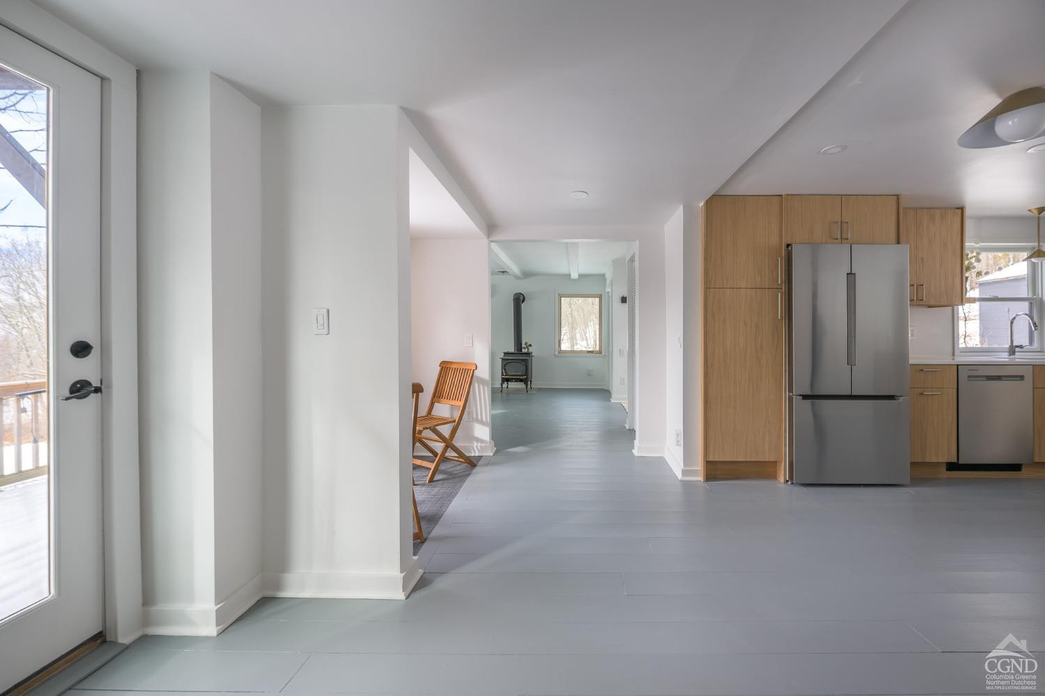 203 Stone Jug Road Craryville, NY 12521 - Photo 10 of 29 a view of a refrigerator in kitchen and an empty room