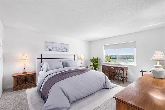 a bedroom with a bed and a table