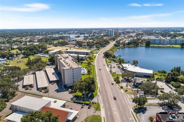 an aerial view of a house with a lake view