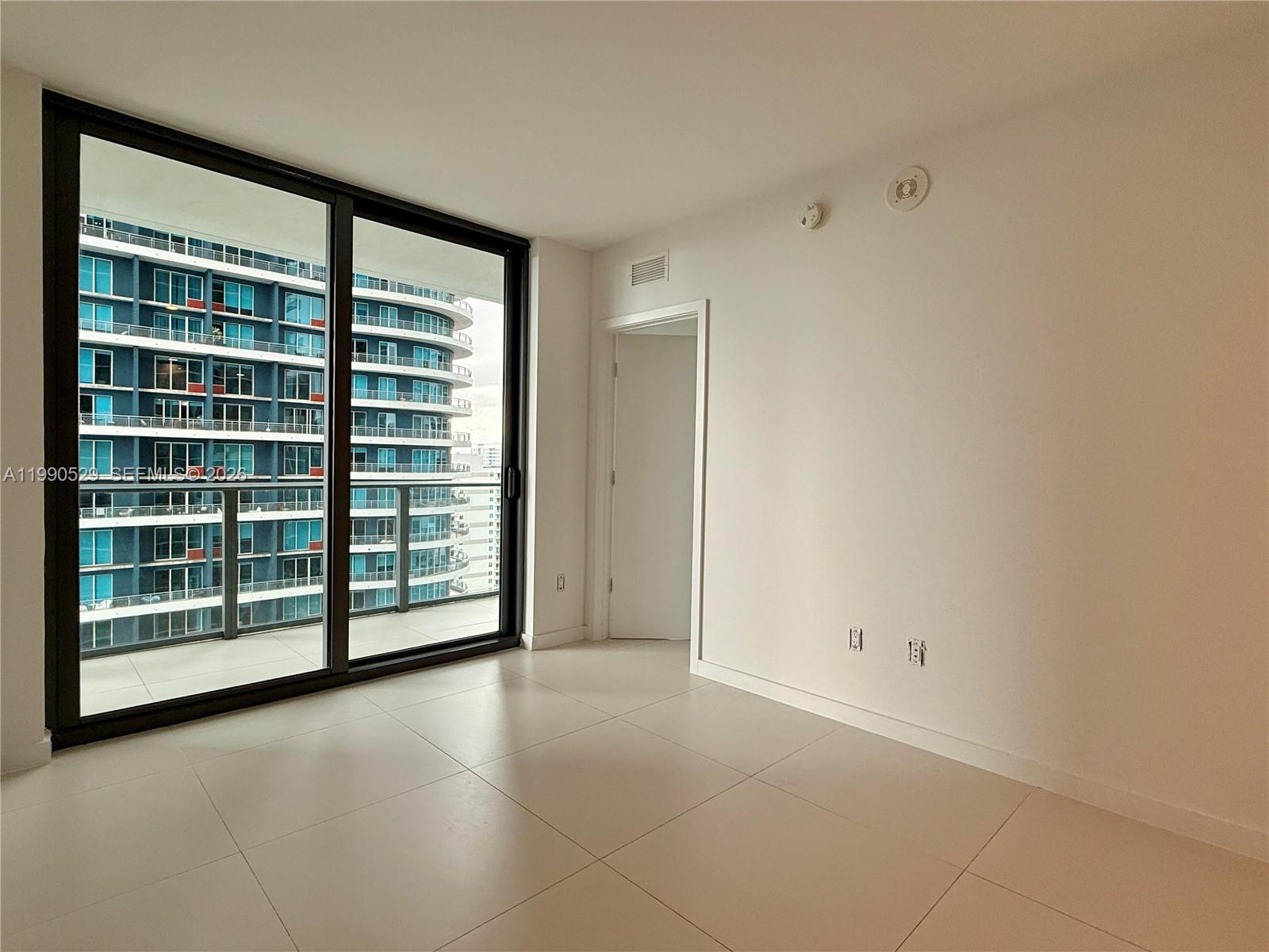 1300 South Miami Avenue, Unit 2008 Miami, FL 33130 - Photo 12 of 29 a view of empty room with windows
