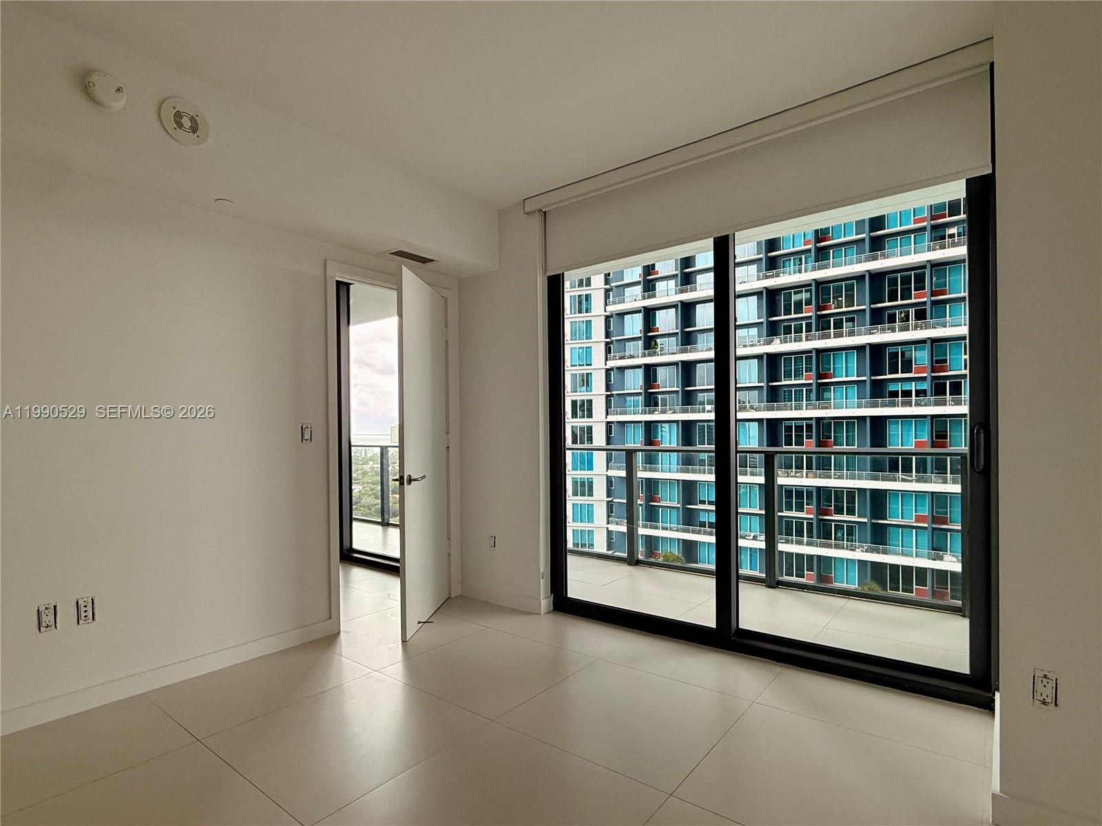 1300 South Miami Avenue, Unit 2008 Miami, FL 33130 - Photo 17 of 29 a view of an empty room with a window