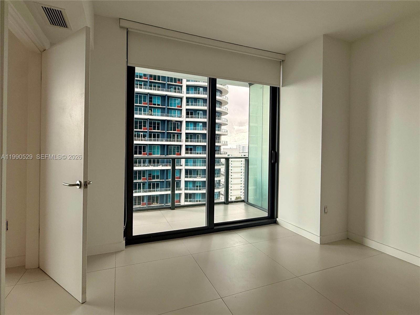 1300 South Miami Avenue, Unit 2008 Miami, FL 33130 - Photo 18 of 29 a view of a room with a large window