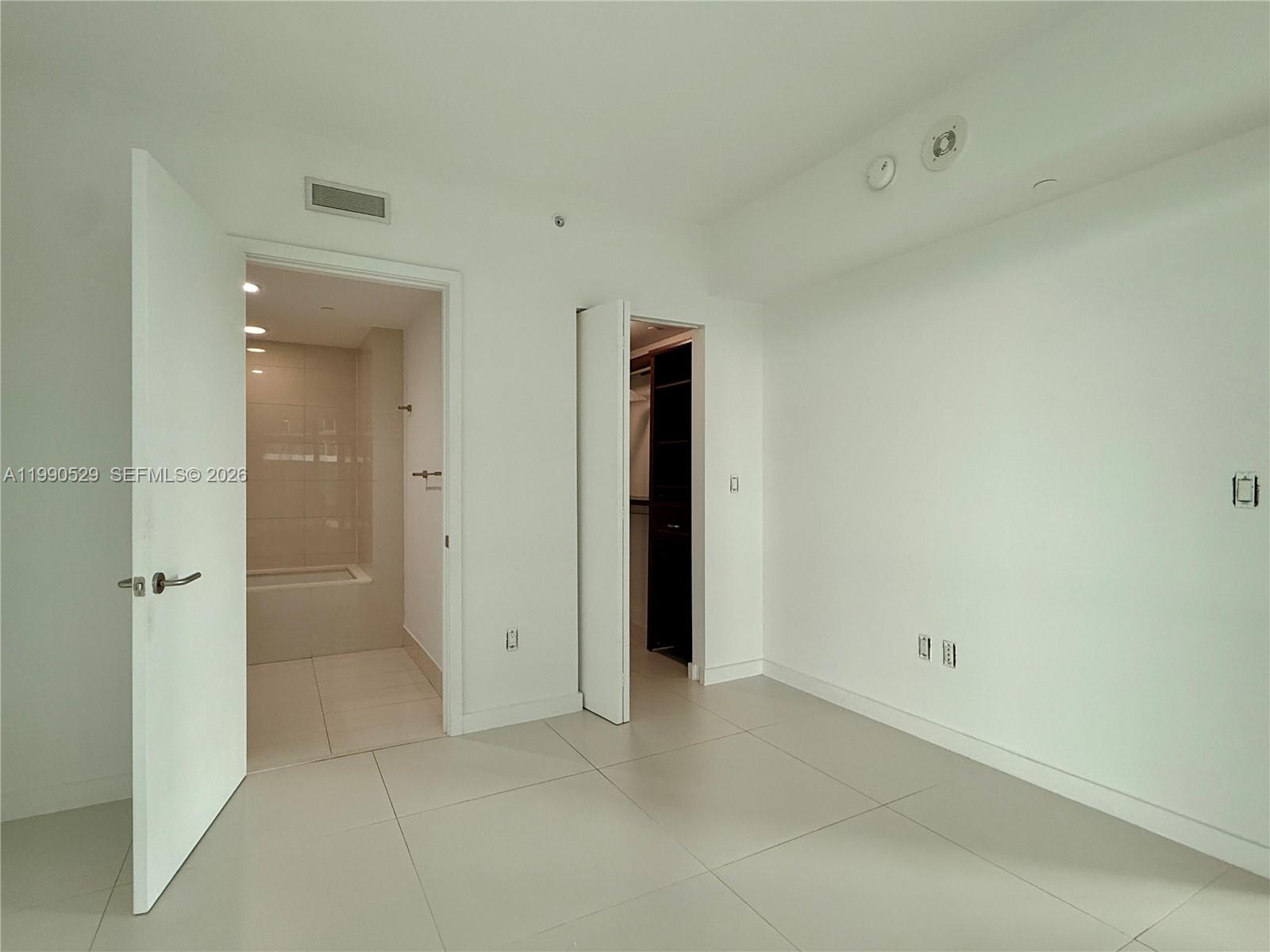 1300 South Miami Avenue, Unit 2008 Miami, FL 33130 - Photo 19 of 29 an empty room with a bathroom