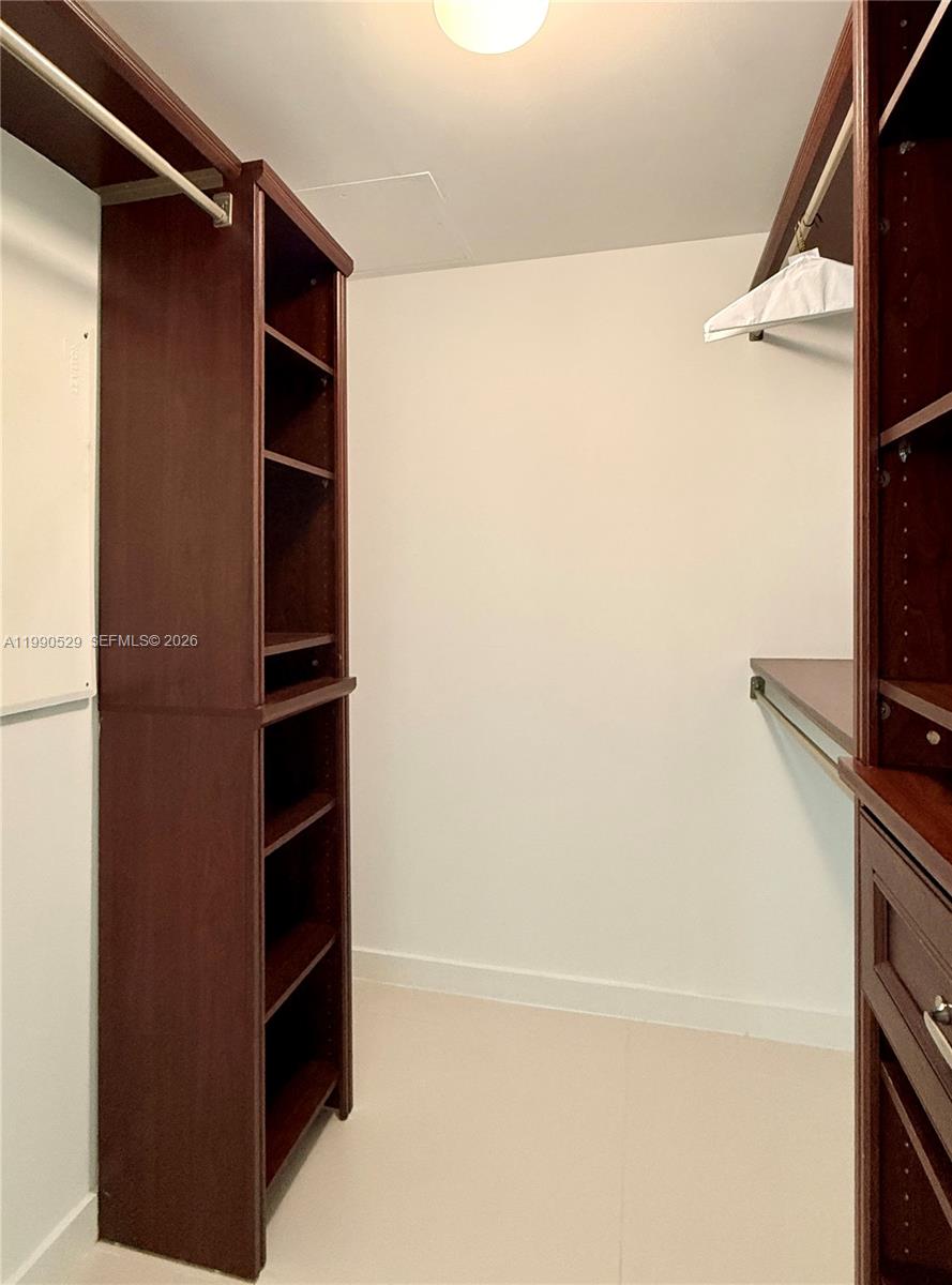 1300 South Miami Avenue, Unit 2008 Miami, FL 33130 - Photo 21 of 29 a view of walk in closet with empty racks