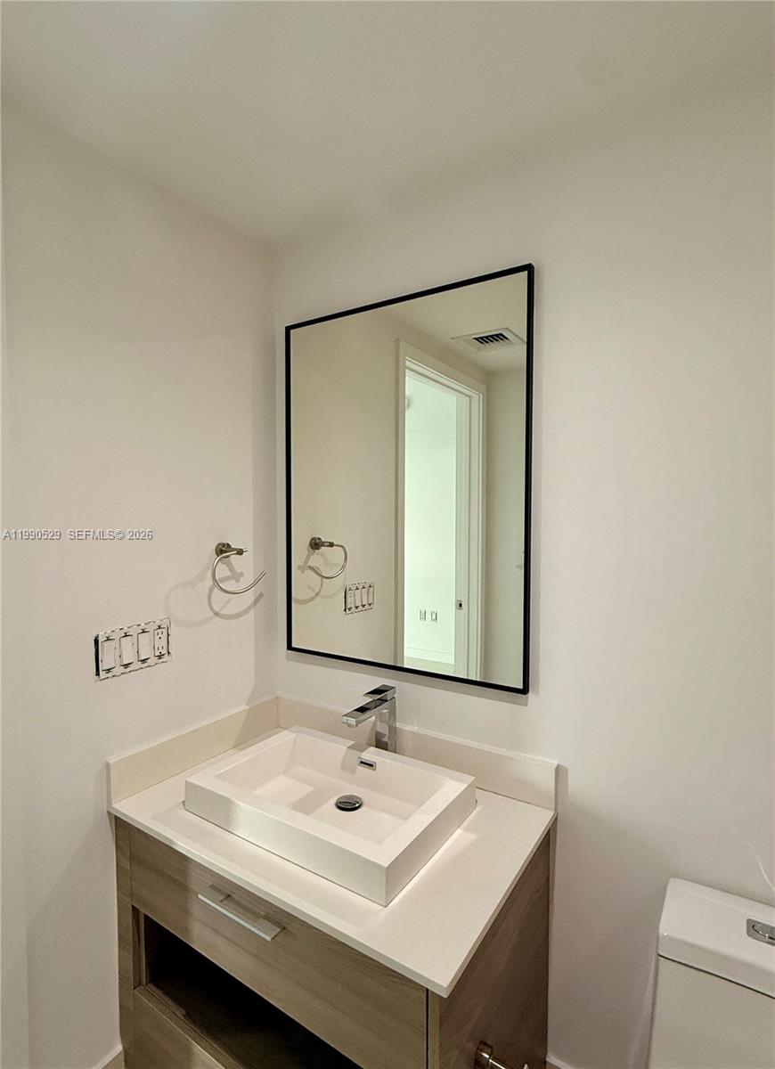 1300 South Miami Avenue, Unit 2008 Miami, FL 33130 - Photo 22 of 29 a bathroom with a sink and a mirror