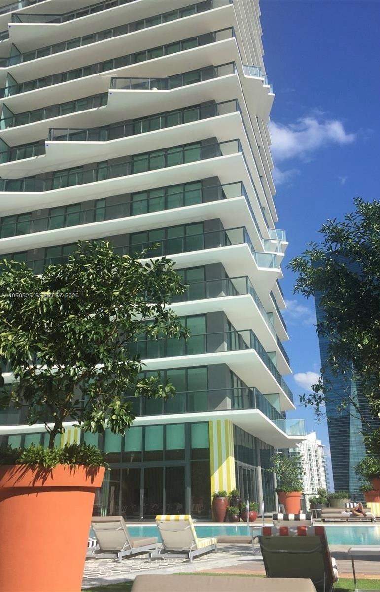 1300 South Miami Avenue, Unit 2008 Miami, FL 33130 - Photo 3 of 29 a view of a tall building next to a yard