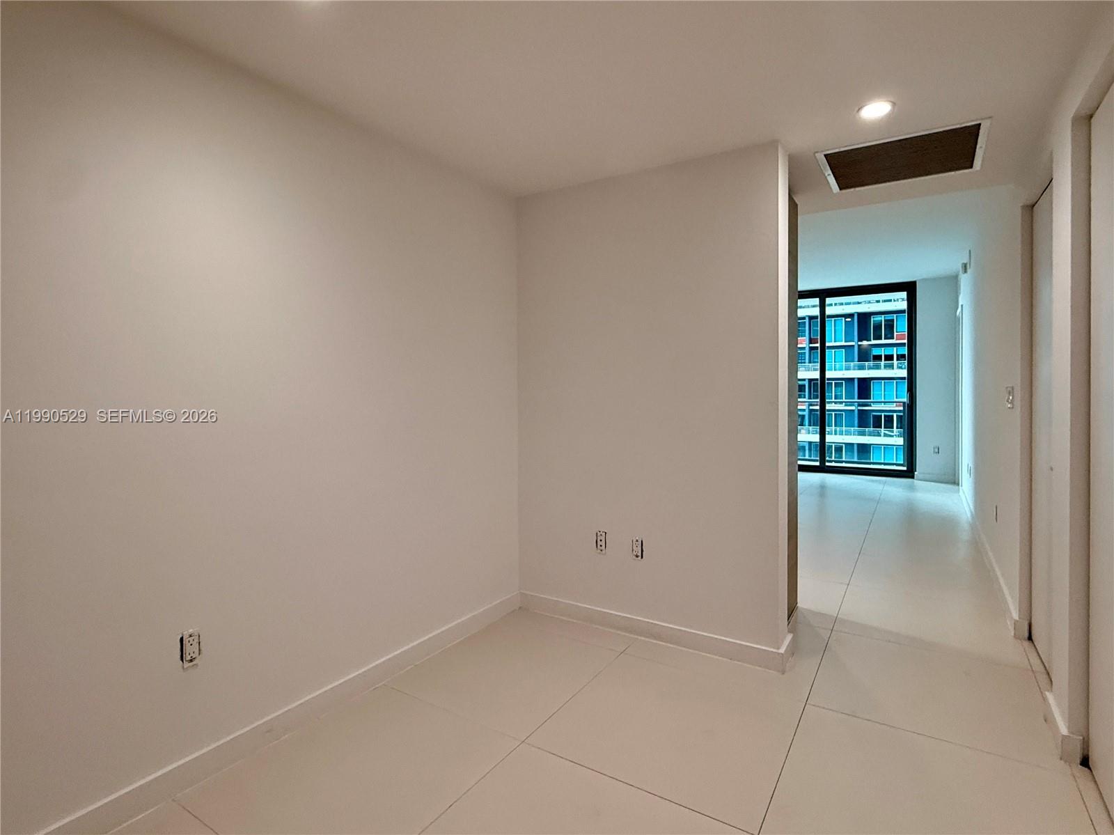 1300 South Miami Avenue, Unit 2008 Miami, FL 33130 - Photo 10 of 29 an empty room with windows