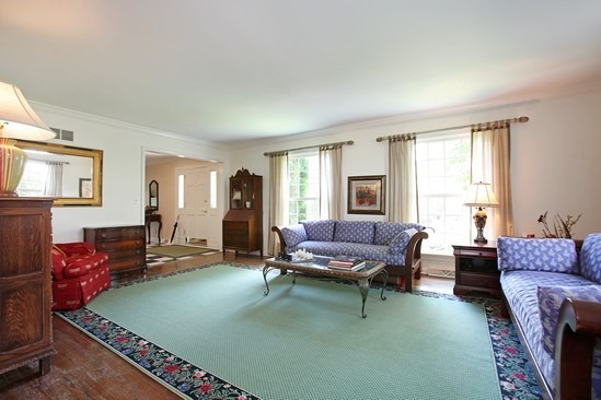 963 Cleveland Road Hinsdale, IL 60521 - Photo 3 of 21 a living room with furniture and a fireplace